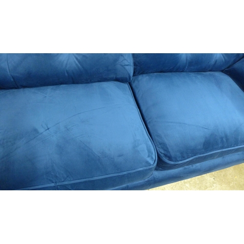 1314 - A pair of Hoxton blue velvet upholstered three seater sofas RRP £1598