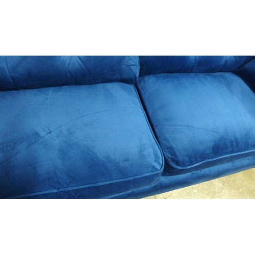 1315 - A pair of Hoxton blue velvet upholstered three seater sofas RRP £1598