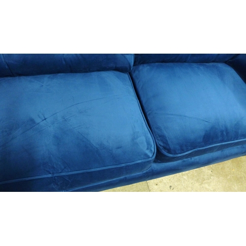 1318 - A pair of Hoxton blue velvet upholstered three seater sofas RRP £1598