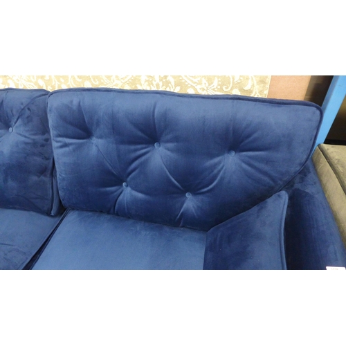 1319 - A Hoxton blue velvet upholstered three seater sofa RRP £799