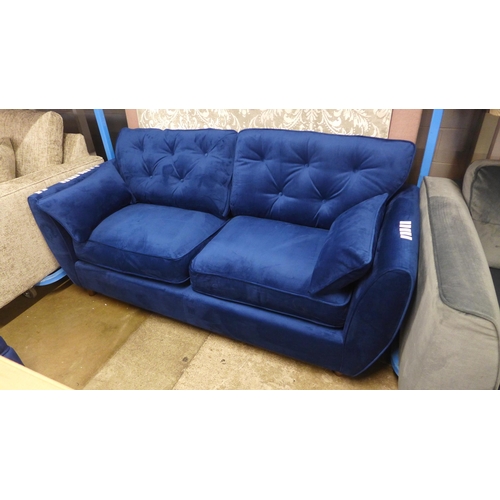 1320 - A Hoxton blue velvet upholstered three seater sofa RRP £799