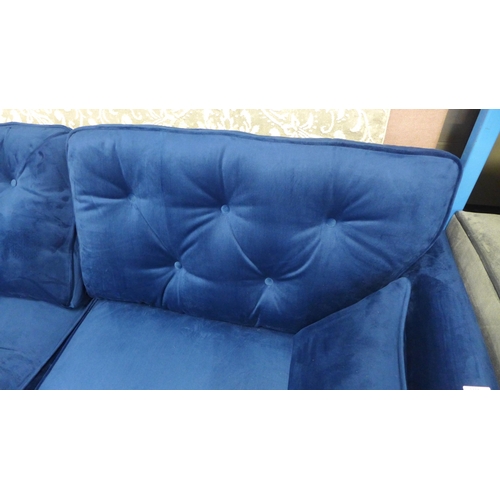 1320 - A Hoxton blue velvet upholstered three seater sofa RRP £799