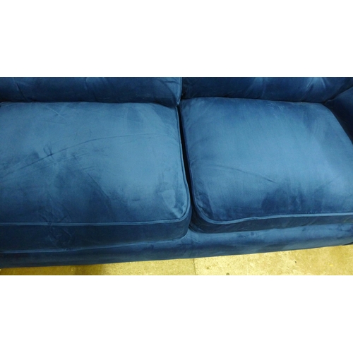 1322 - A Hoxton blue velvet upholstered three seater sofa RRP £799