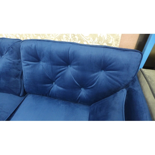 1323 - A Hoxton blue velvet upholstered three seater sofa RRP £799