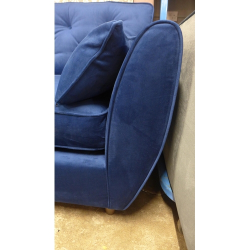 1325 - A Hoxton blue velvet upholstered three seater sofa RRP £799