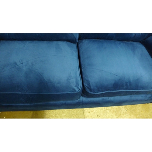 1327 - A Hoxton blue velvet upholstered three seater sofa RRP £799