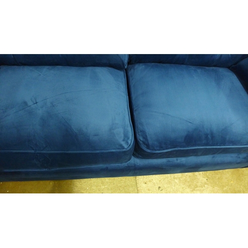 1328 - A Hoxton blue velvet upholstered three seater sofa RRP £799