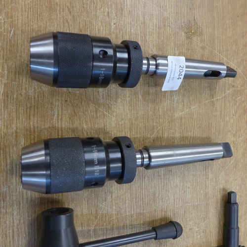 2044 - Two lathe chucks and small amount of attachments