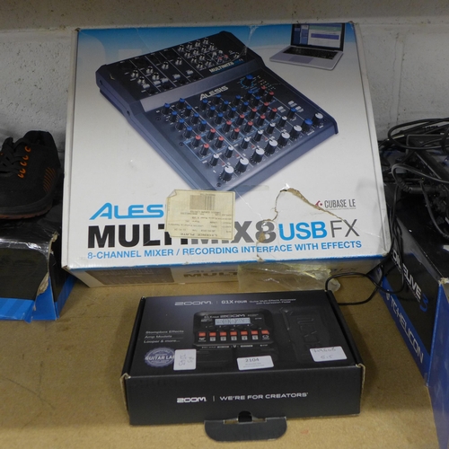 2104 - A Zoom G1X four guitar multi effects processor with expression pedal and an Alesis Multimix 8 USB FX... 