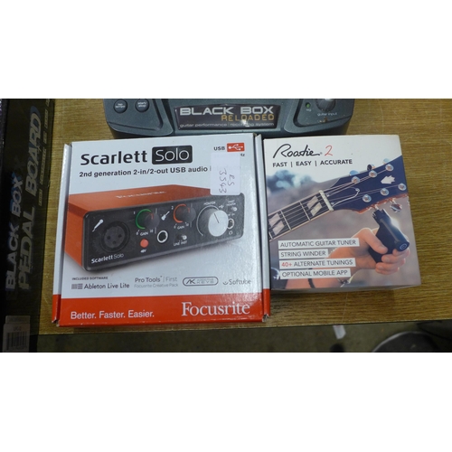 2106 - An M-Gear EXP guitar effects pedal, a Roadie 2 string winder/automatic guitar tuner, a Scarlett Solo... 