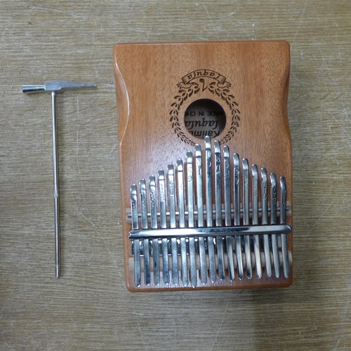 2108 - A 17 key Laqula Kalimba with protective case, soft bag, playing accessories and information on how t... 