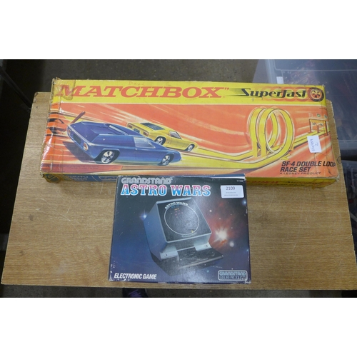 2109 - A Matchbox Superfast SP-4 Double Loop Race Set and a Grandstand Astro Wars