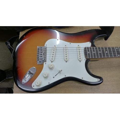 2140 - A Fender Squier Strat electric guitar in soft case