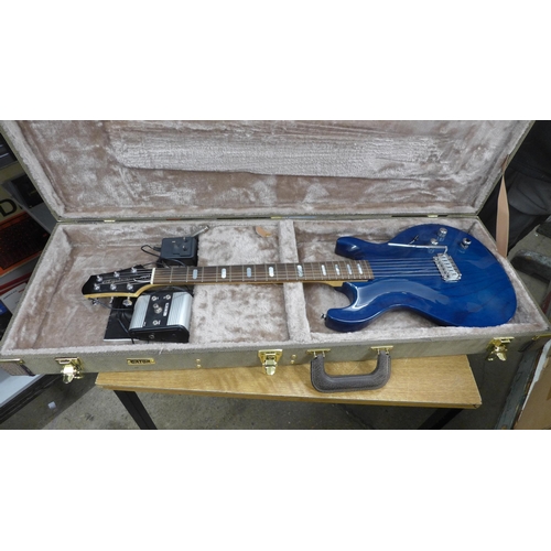 2142 - A Line 6 Variax electric guitar in a plush protective hard case and a Line 6 JTV Variax cabled power... 