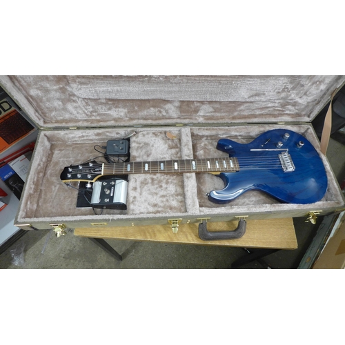 2142 - A Line 6 Variax electric guitar in a plush protective hard case and a Line 6 JTV Variax cabled power... 