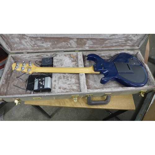 2142 - A Line 6 Variax electric guitar in a plush protective hard case and a Line 6 JTV Variax cabled power... 