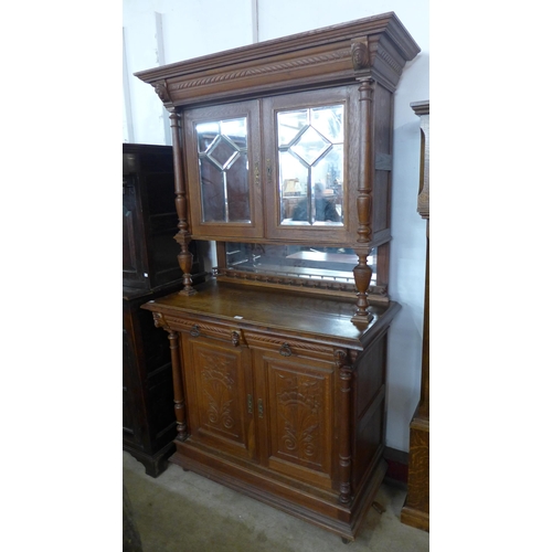 100 - A 19th Century French Henry II style oak side cabinet