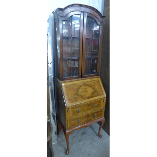 103 - A Queen Anne style figured walnut bureau bookcase