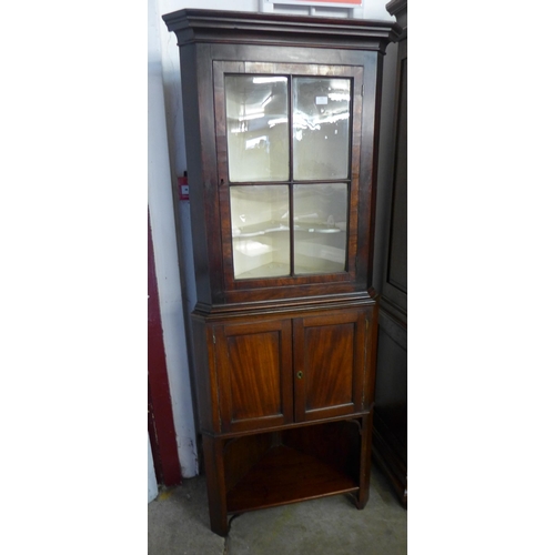 106 - A George III mahogany freestanding corner cabinet