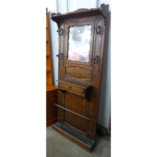 107 - An early 20th Century French carved oak hallstand