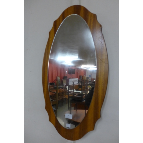 18 - A teak framed mirror