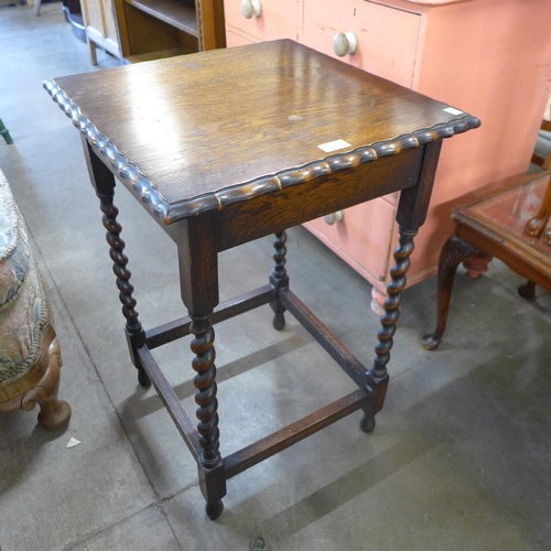 188 - An oak barleytwist occasional table