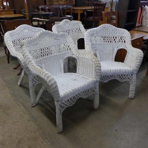 225 - A et of four painted wicker chairs