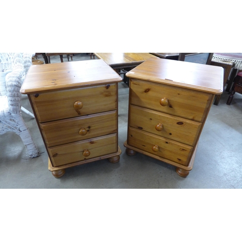 226 - A pair of pine bedside chests