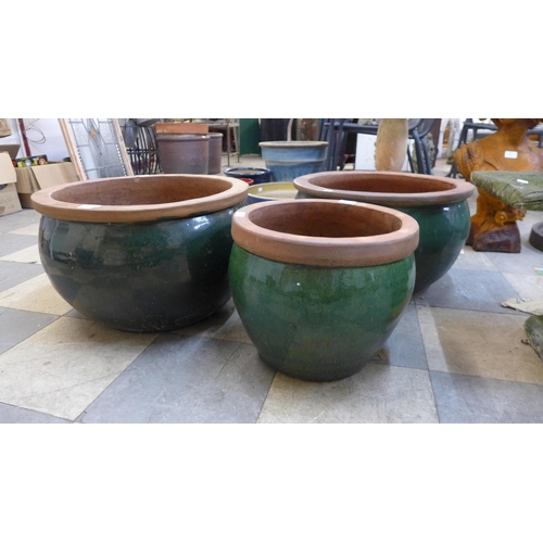 257 - Three green glazed terracotta garden planters