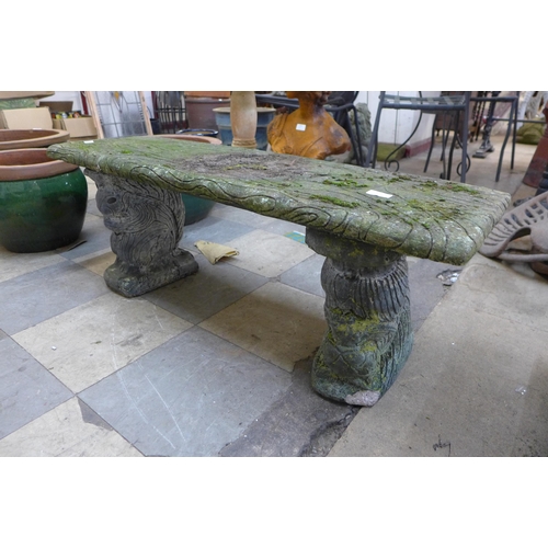 265 - A concrete pedestal garden bench