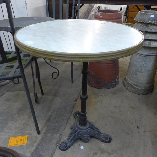 270 - A cast iron and simulated marble topped circular pub table