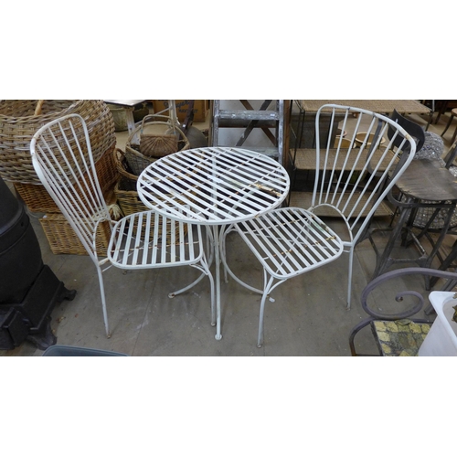 278 - A painted wrought alloy garden table and two chairs