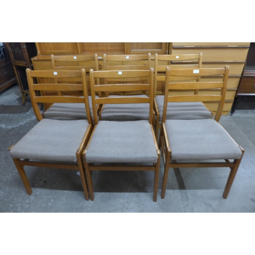 28 - A set of six teak dining chairs