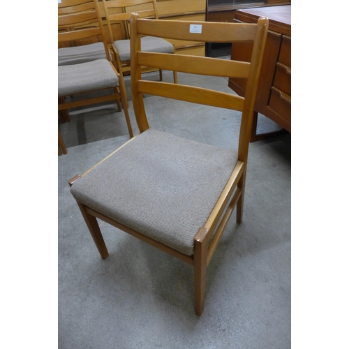 28 - A set of six teak dining chairs