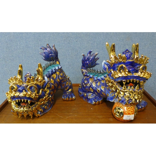 330 - A pair of Chinese painted porcelain dogs of foe