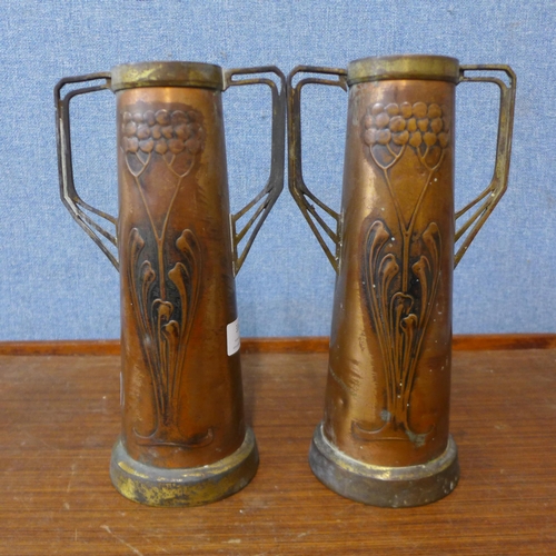 336 - A pair of Arts and Crafts copper and brass two handled vases