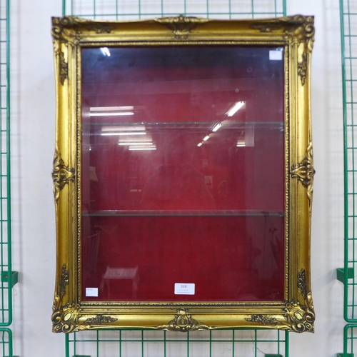 338 - A French gilt framed wall hanging display cabinet