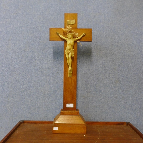 340 - A French oak freestanding table top crucifix