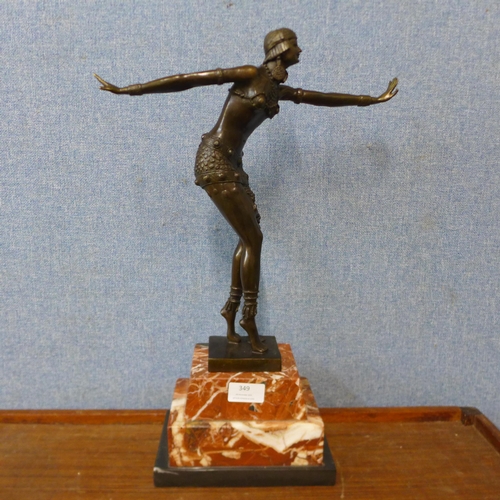 349 - An Art Deco style bronze figure of an exotic female dancer, on rouge marble socle