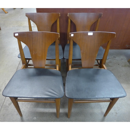 36 - A set of four teak dining chairs