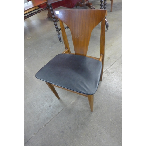 36 - A set of four teak dining chairs