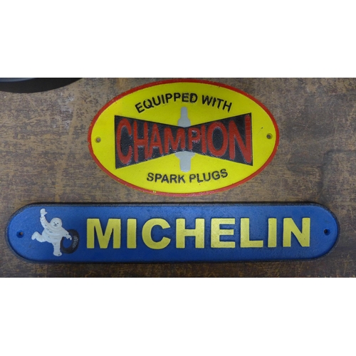 360 - Two painted cast iron advertising signs, Michelin and Champion