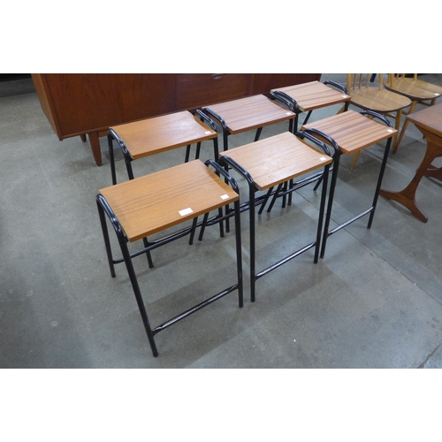 37 - A set of six teak and and black tubular steel stools