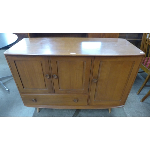 41 - An Ercol elm Windsor sideboard