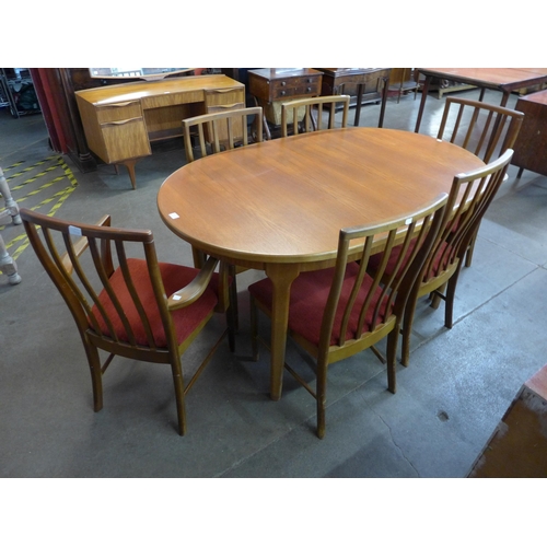 43A - A McIntosh teak oval extending dining table and six chairs