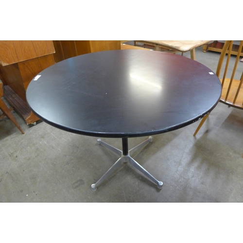 44 - An Eames style aluminium and black lacquered circular dining table