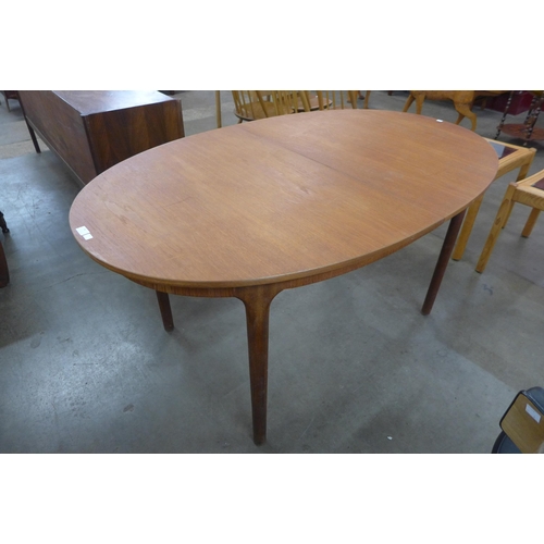 48 - A McIntosh teak oval extending dining table