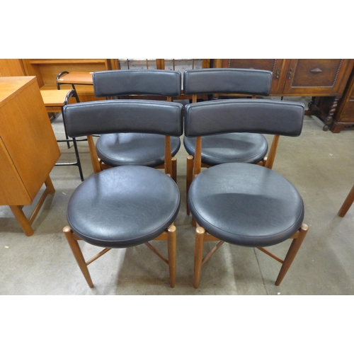 49 - A set of four G-Plan Fresco teak and black vinyl dining chairs