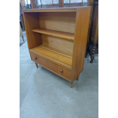 57 - A small teak bookcase