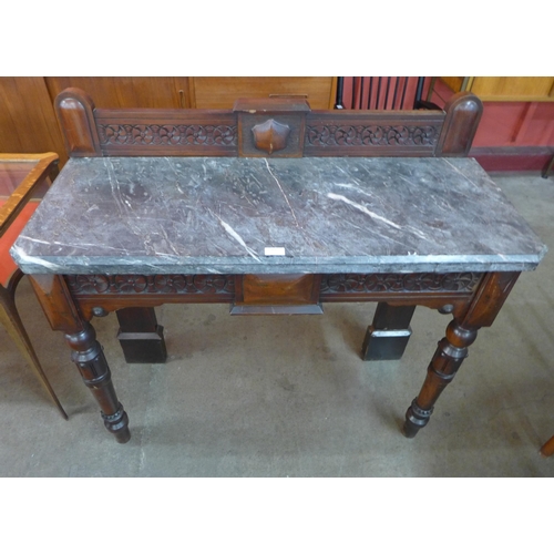 63 - A Victorian Gothic Revival mahogany and marble topped console table, stamped Widger Maker, Plymouth